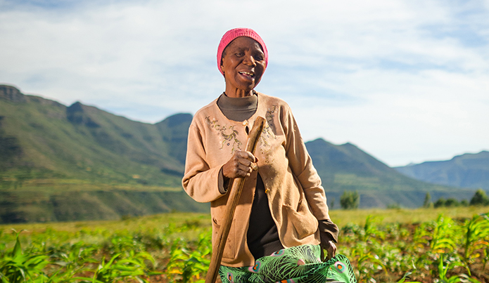 African woman standing in field